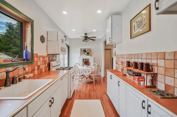 a kitchen with stainless steel appliances lots of counter top space