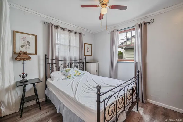 a bedroom with a bed and a table