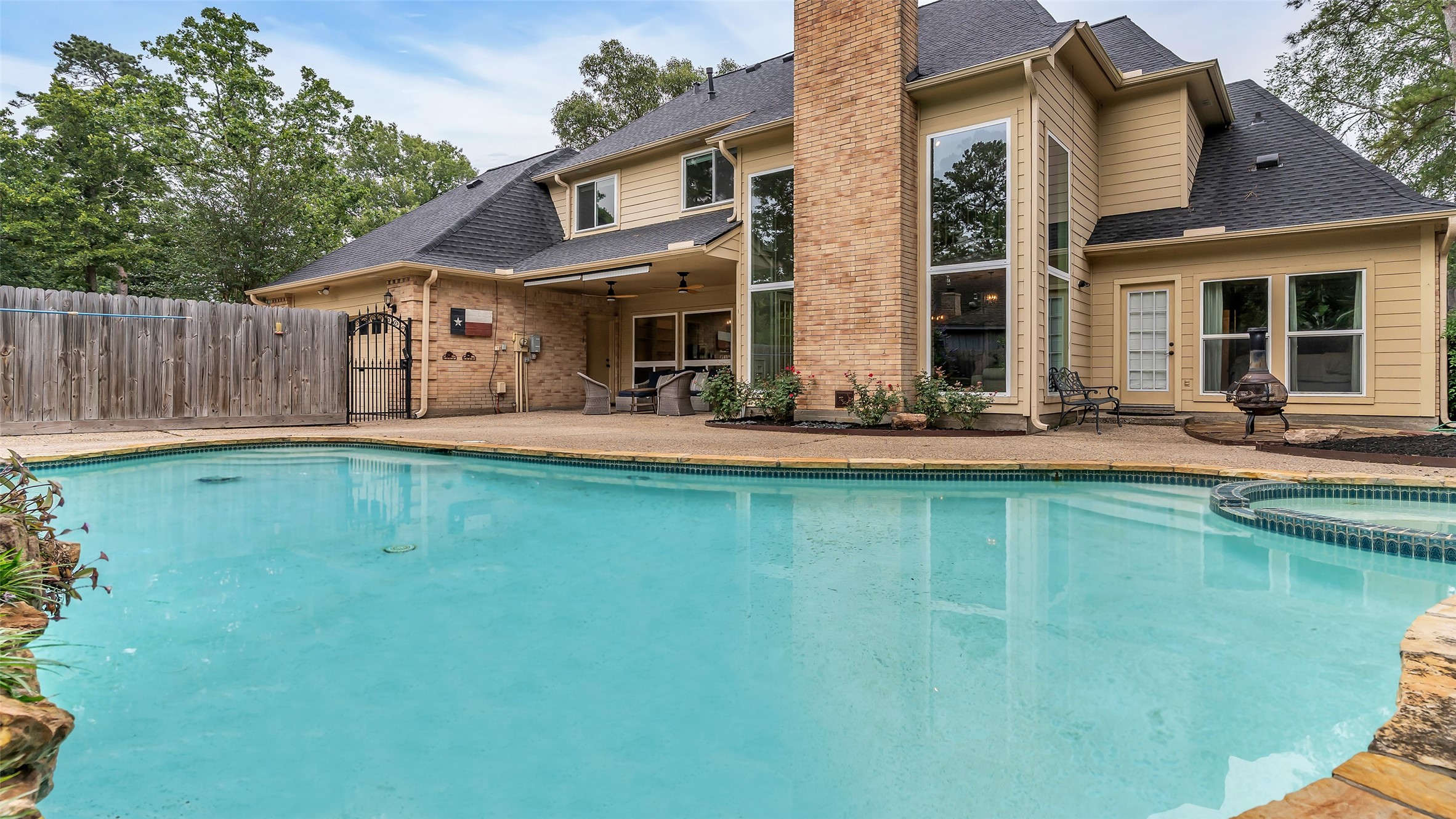 2607 Laurel Ridge Drive Houston, TX 77345 - Photo 43 of 47 a front view of a house with a yard table and chairs