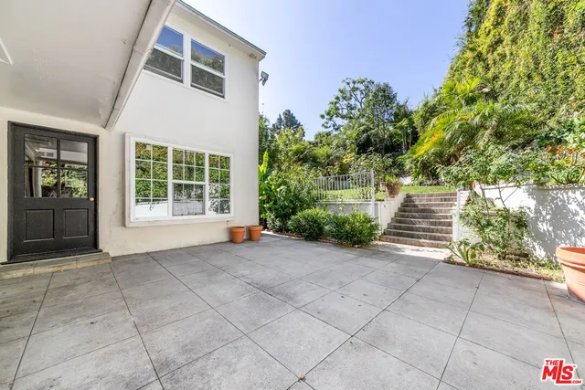 a view of backyard with green space