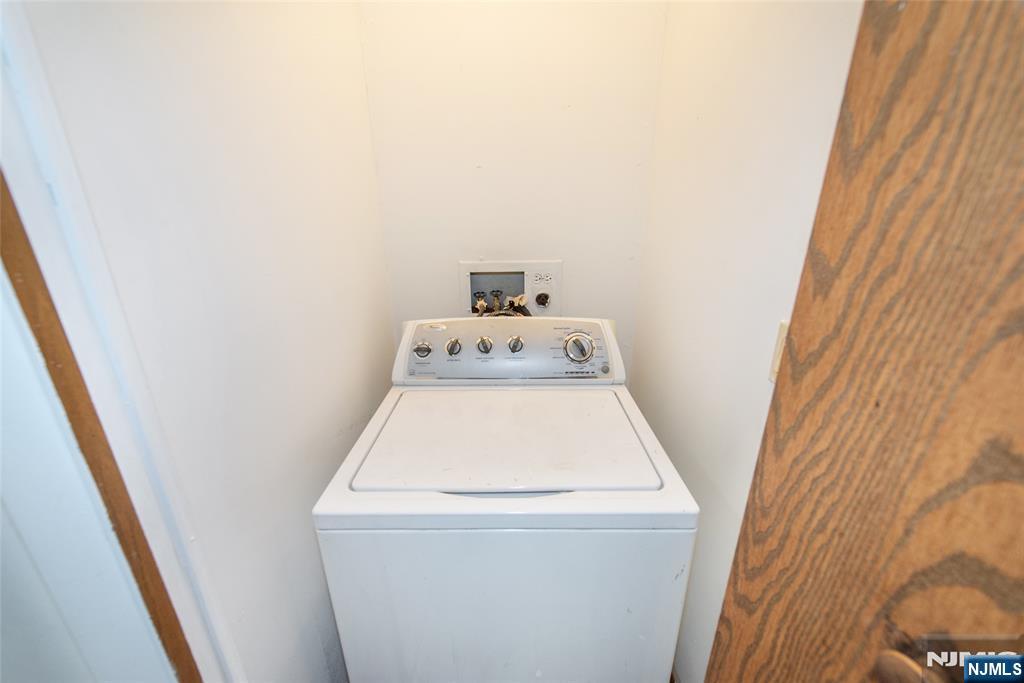 553 Ocean Avenue Jersey City, NJ 07305 - Photo 13 of 27 a utility room with dryer and washer