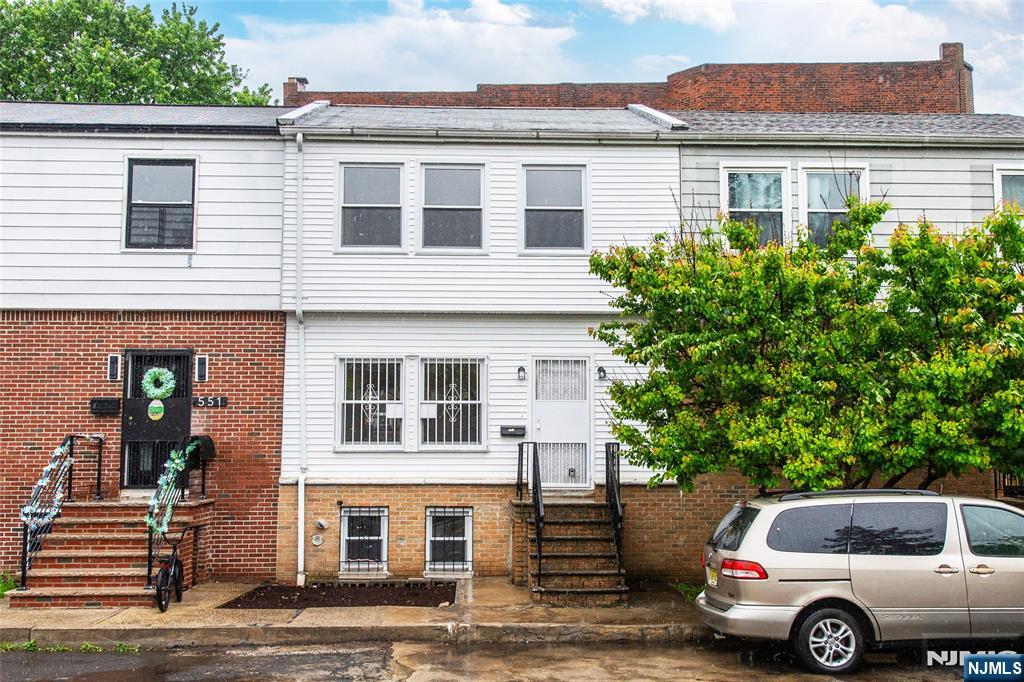 553 Ocean Avenue Jersey City, NJ 07305 - Photo 25 of 27 a front view of a house with a yard