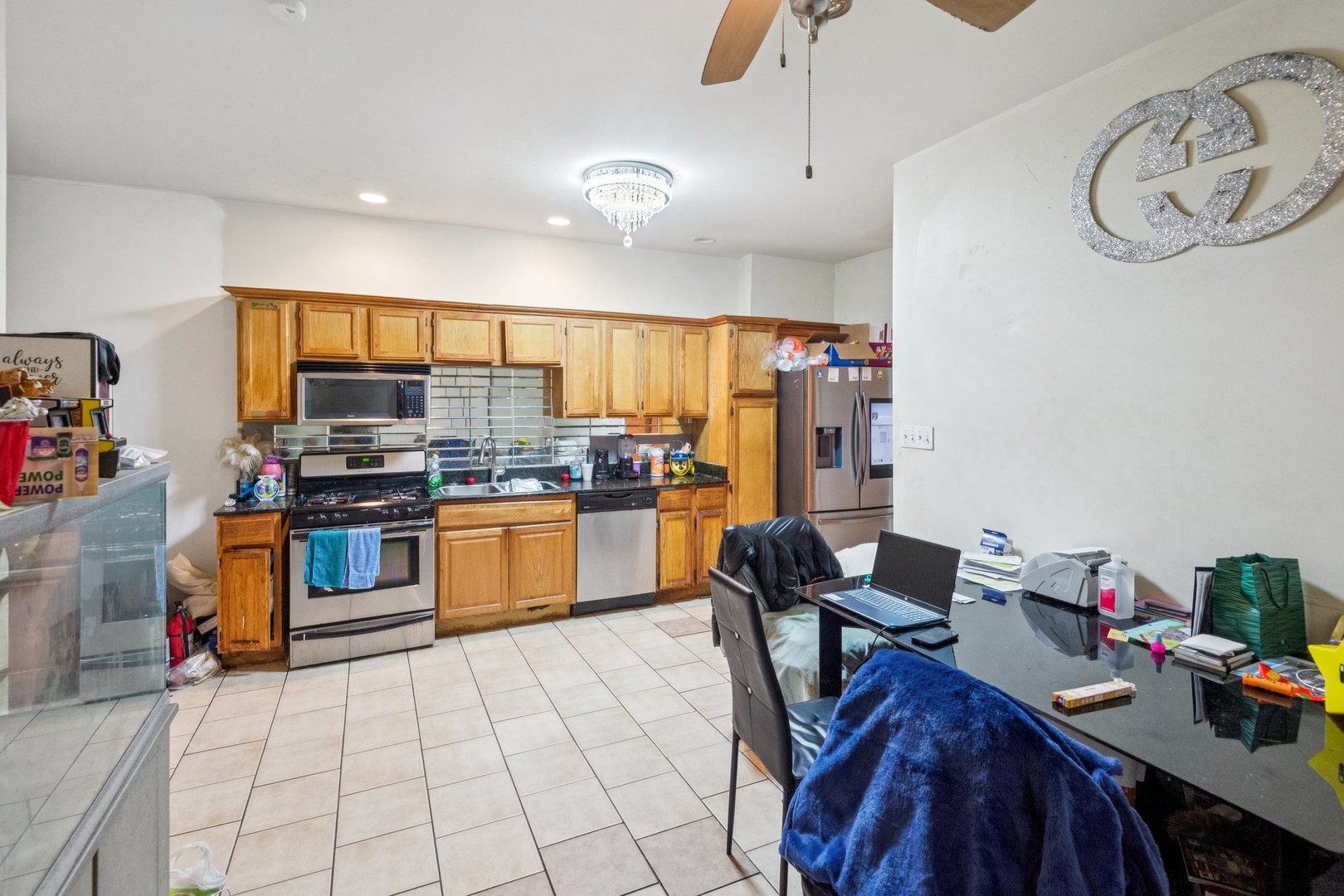 5016 South Prairie Avenue, Unit 1 Chicago, IL 60615 - Photo 5 of 10 a kitchen with a sink appliances and cabinets