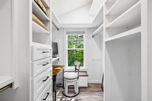 a bathroom with a toilet a sink and a window