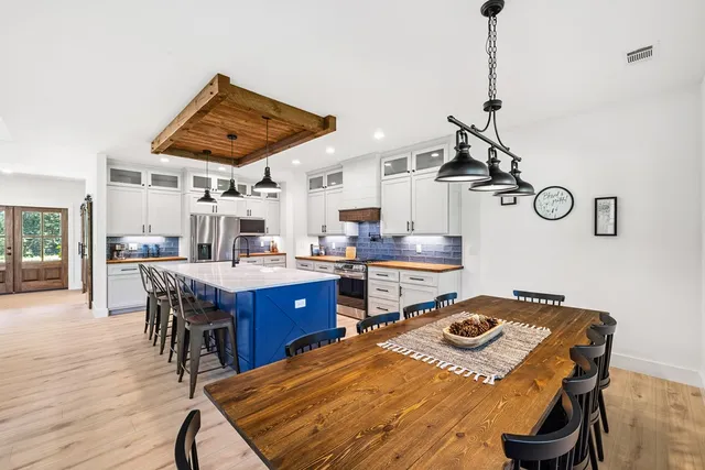 a open kitchen with a table and chairs in it