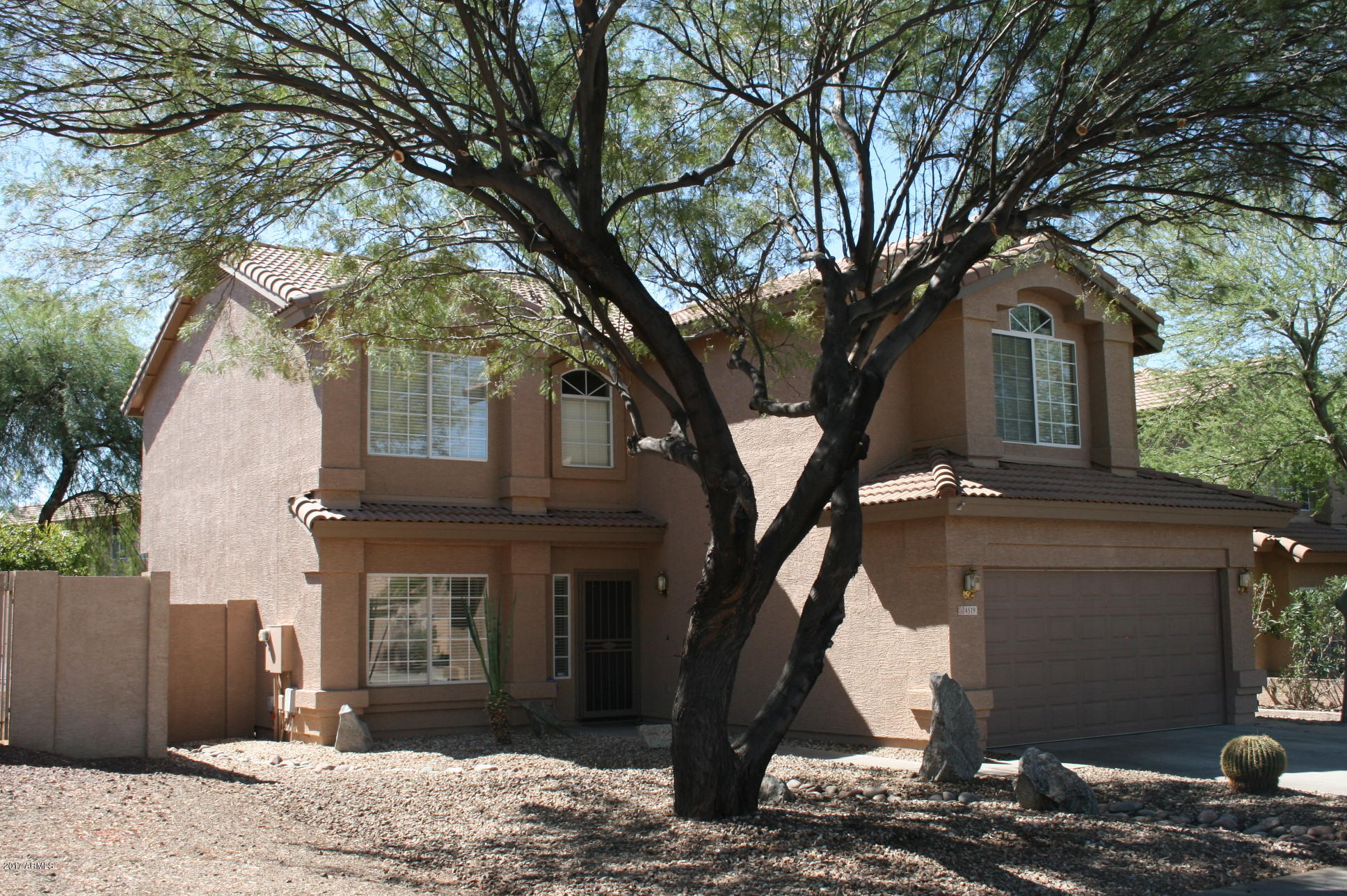 4519 East Rowel Road Phoenix, AZ 85050 - Photo 1 of 28 a front view of a house with a yard