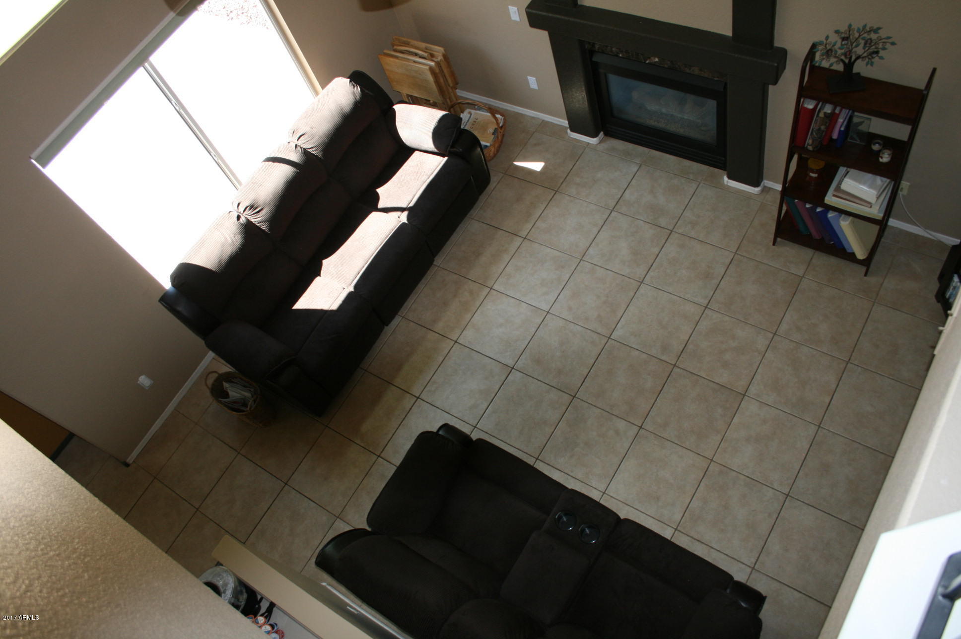 4519 East Rowel Road Phoenix, AZ 85050 - Photo 18 of 28 a living room with furniture and a fireplace