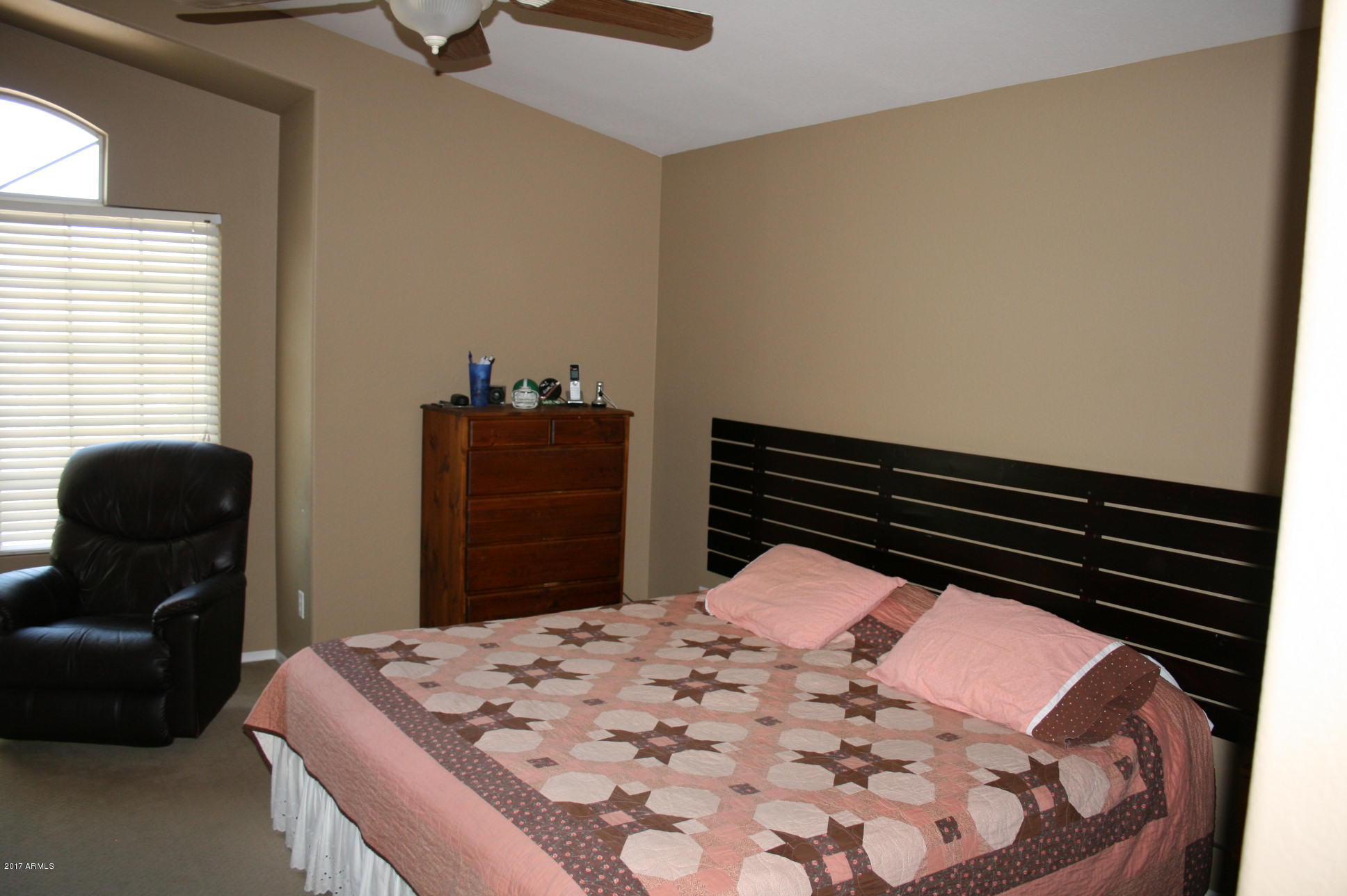 4519 East Rowel Road Phoenix, AZ 85050 - Photo 19 of 28 a bedroom with a bed and a dresser
