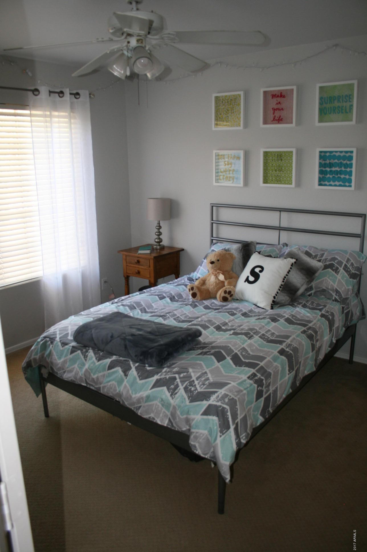 4519 East Rowel Road Phoenix, AZ 85050 - Photo 24 of 28 a bedroom with a bed and a window