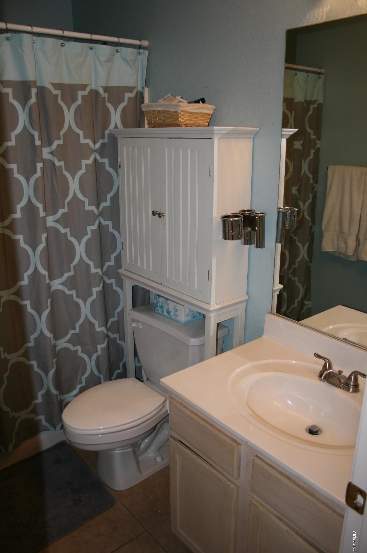 4519 East Rowel Road Phoenix, AZ 85050 - Photo 27 of 28 a bathroom with a sink a toilet and shower