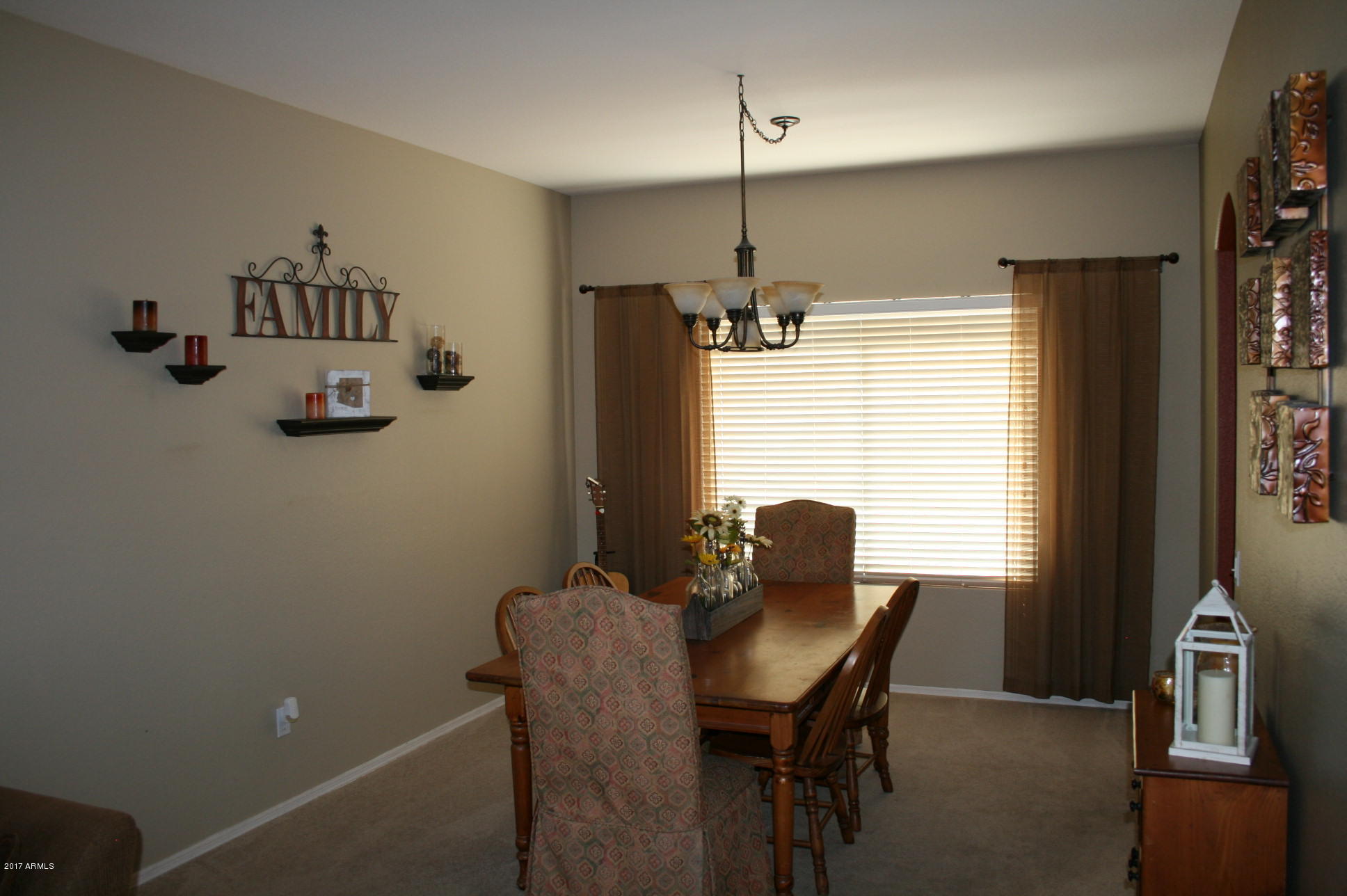 4519 East Rowel Road Phoenix, AZ 85050 - Photo 4 of 28 a view of a dining room with furniture window and outside view