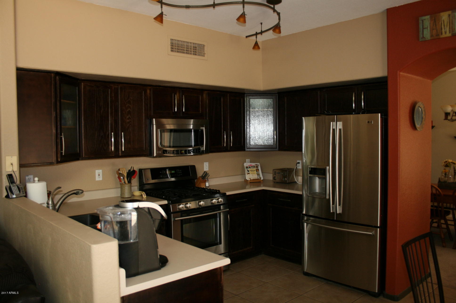 4519 East Rowel Road Phoenix, AZ 85050 - Photo 6 of 28 a kitchen with a refrigerator stove and sink