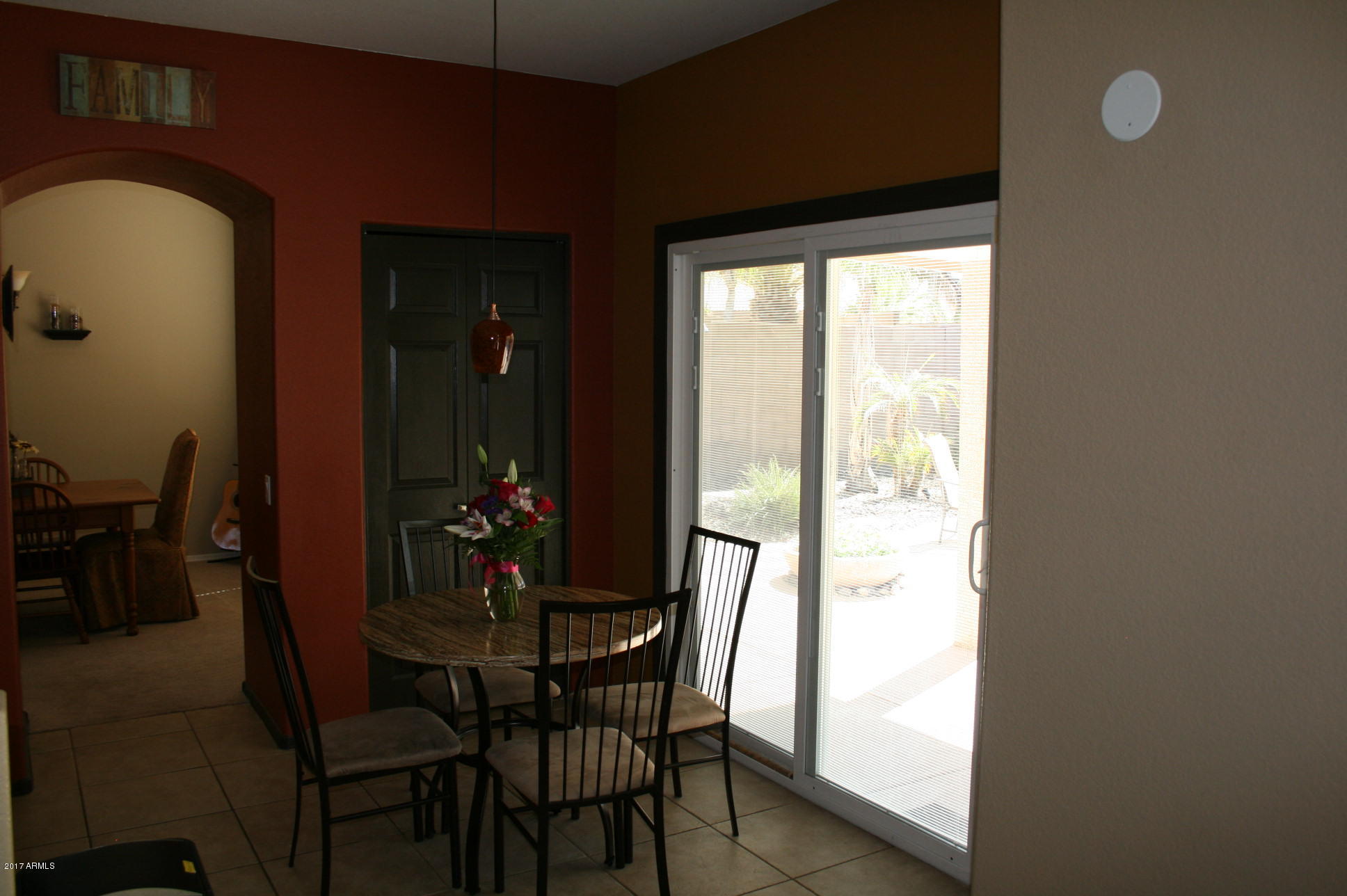 4519 East Rowel Road Phoenix, AZ 85050 - Photo 7 of 28 a view of a dining room with furniture and window