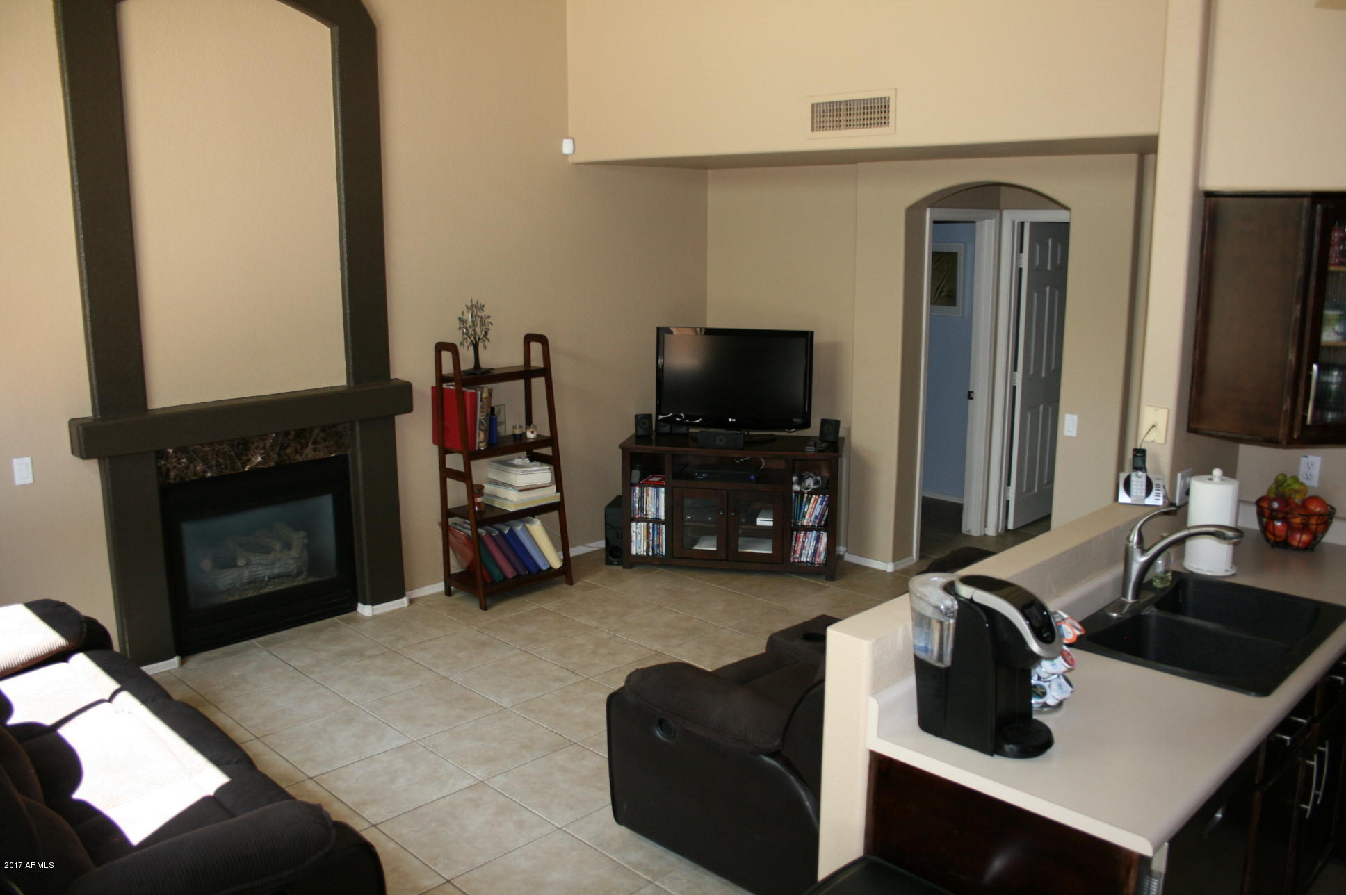 4519 East Rowel Road Phoenix, AZ 85050 - Photo 8 of 28 a living room with furniture and a flat screen tv