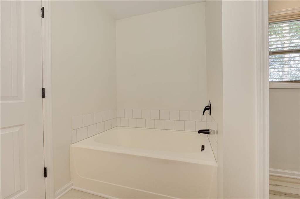 605 Summit Point Canton, GA 30114 - Photo 35 of 56 a bathroom with a bathtub