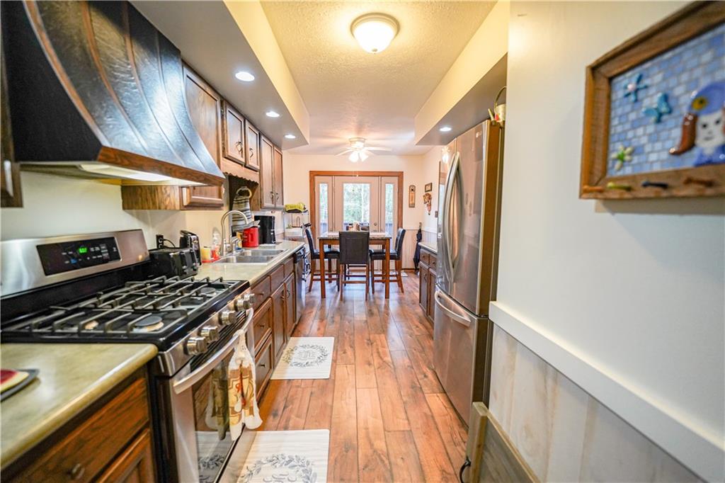 809 Enterprise Road Grove City, PA 16127 - Photo 20 of 43 a kitchen with stainless steel appliances granite countertop a stove and a refrigerator