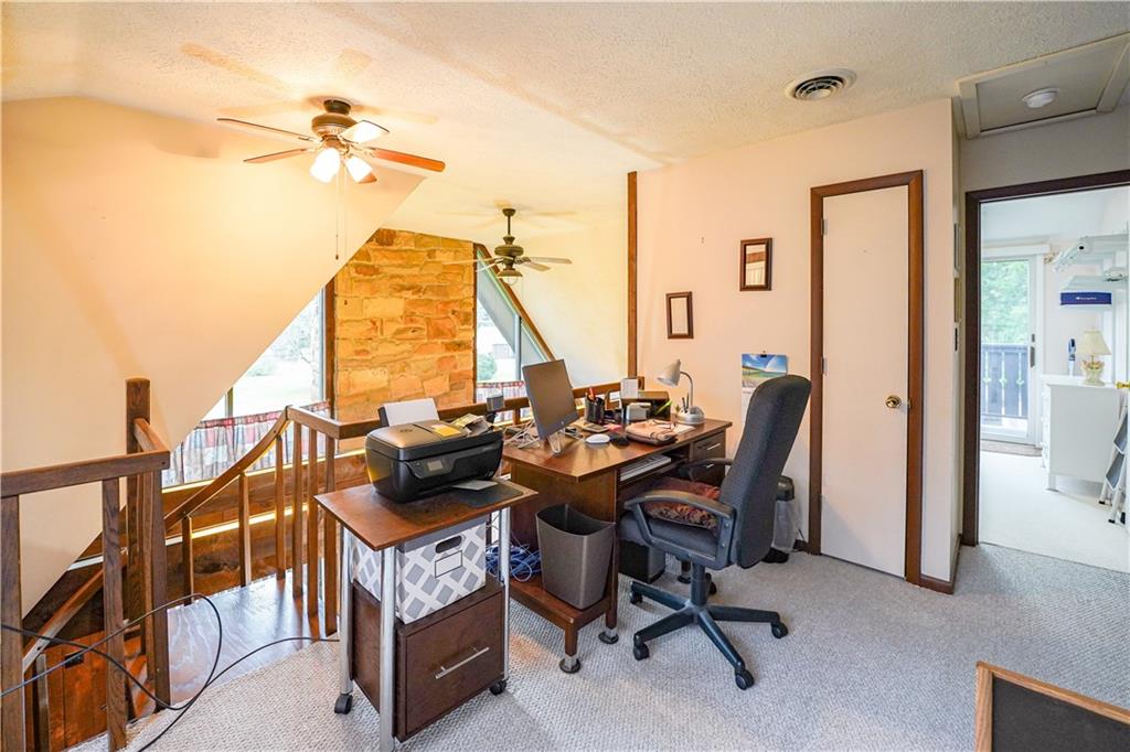 809 Enterprise Road Grove City, PA 16127 - Photo 24 of 43 a view of a workspace with furniture and a window
