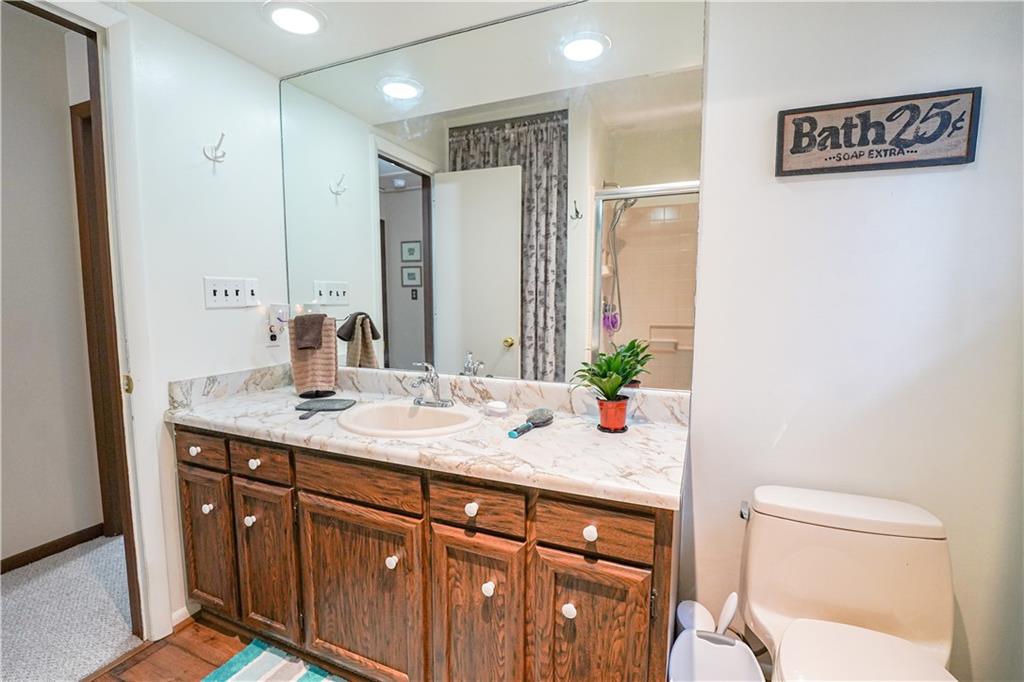 809 Enterprise Road Grove City, PA 16127 - Photo 29 of 43 a bathroom with a granite countertop sink toilet and shower