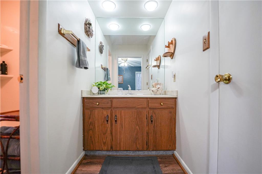 809 Enterprise Road Grove City, PA 16127 - Photo 36 of 43 a bathroom with a granite countertop sink vanity and mirror
