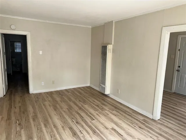 a view of wooden floor in an empty room