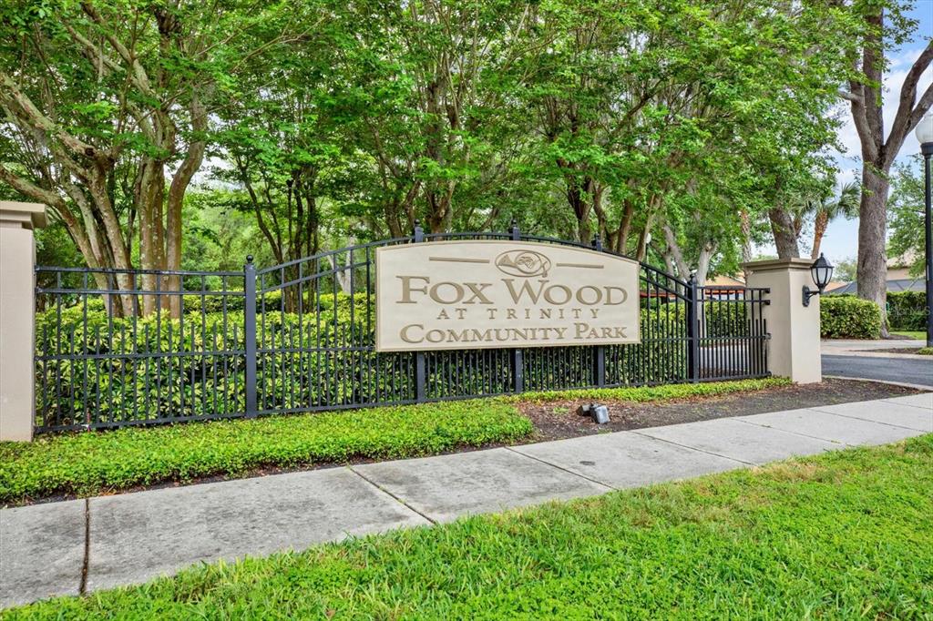 2021 Meadow Rue Court Trinity, FL 34655 - Photo 38 of 41 a sign on the side of a building