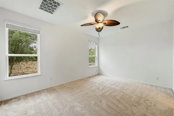 an empty room with closet and wooden floor