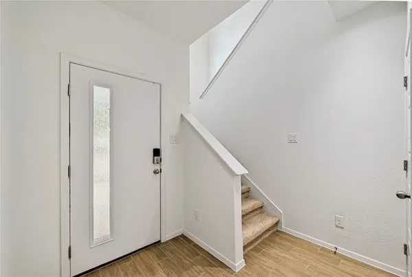a view of a hallway with staircase