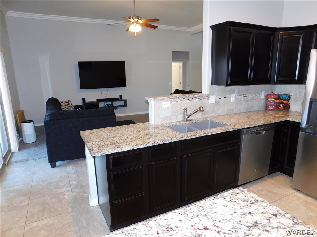 3370 South Ridge Avenue Bullhead City, AZ 86429 - Photo 32 of 56 a kitchen with a sink and a microwave