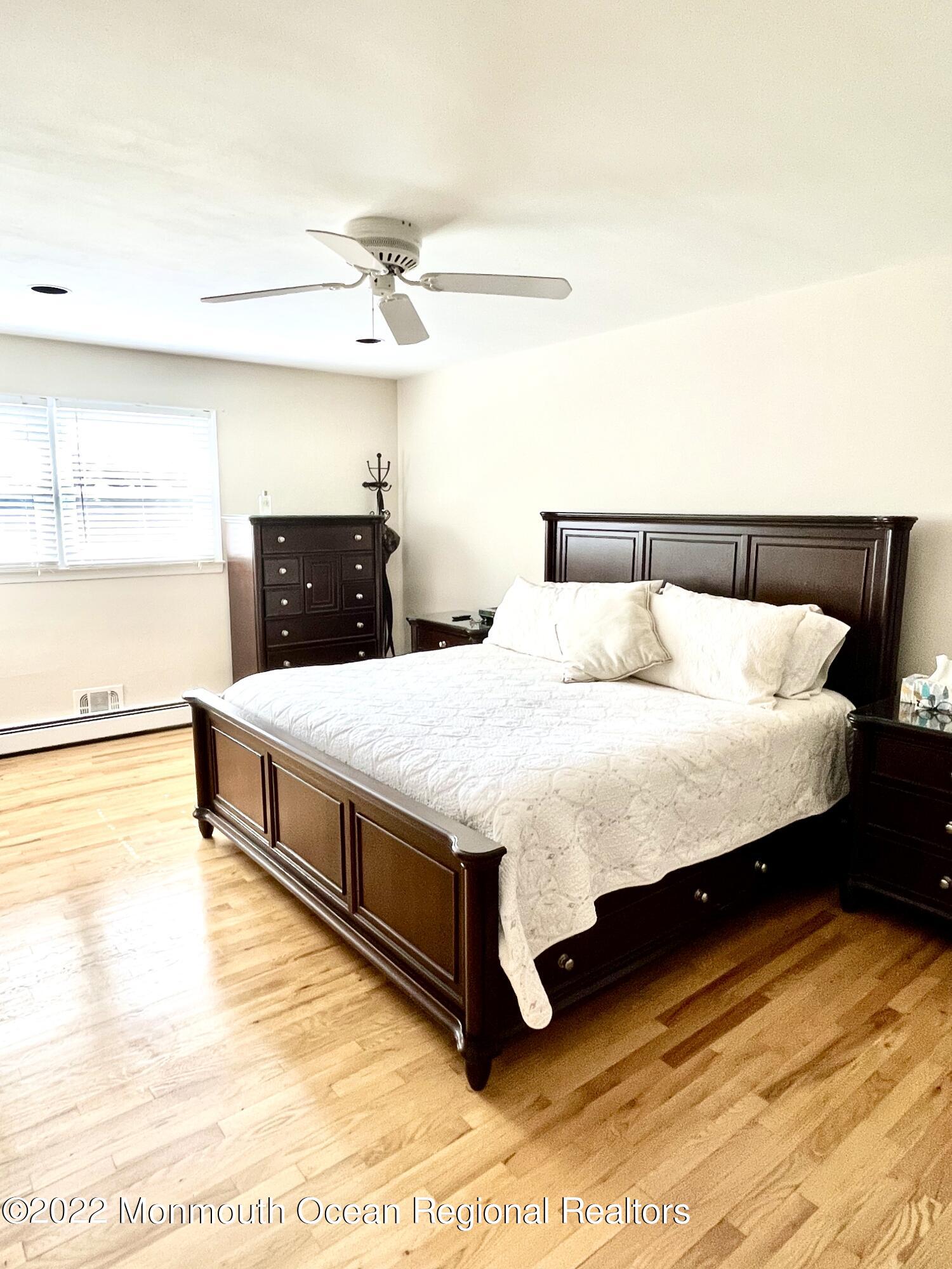 30 Homestead Road Freehold, NJ 07728 - Photo 36 of 42 a bed sitting in a bedroom next to a window