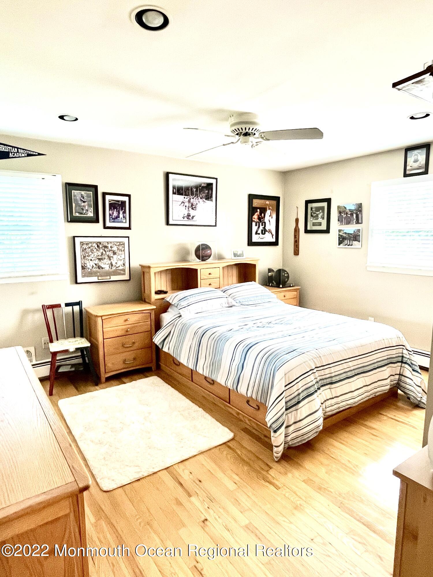 30 Homestead Road Freehold, NJ 07728 - Photo 38 of 42 a bedroom with a bed and a couch