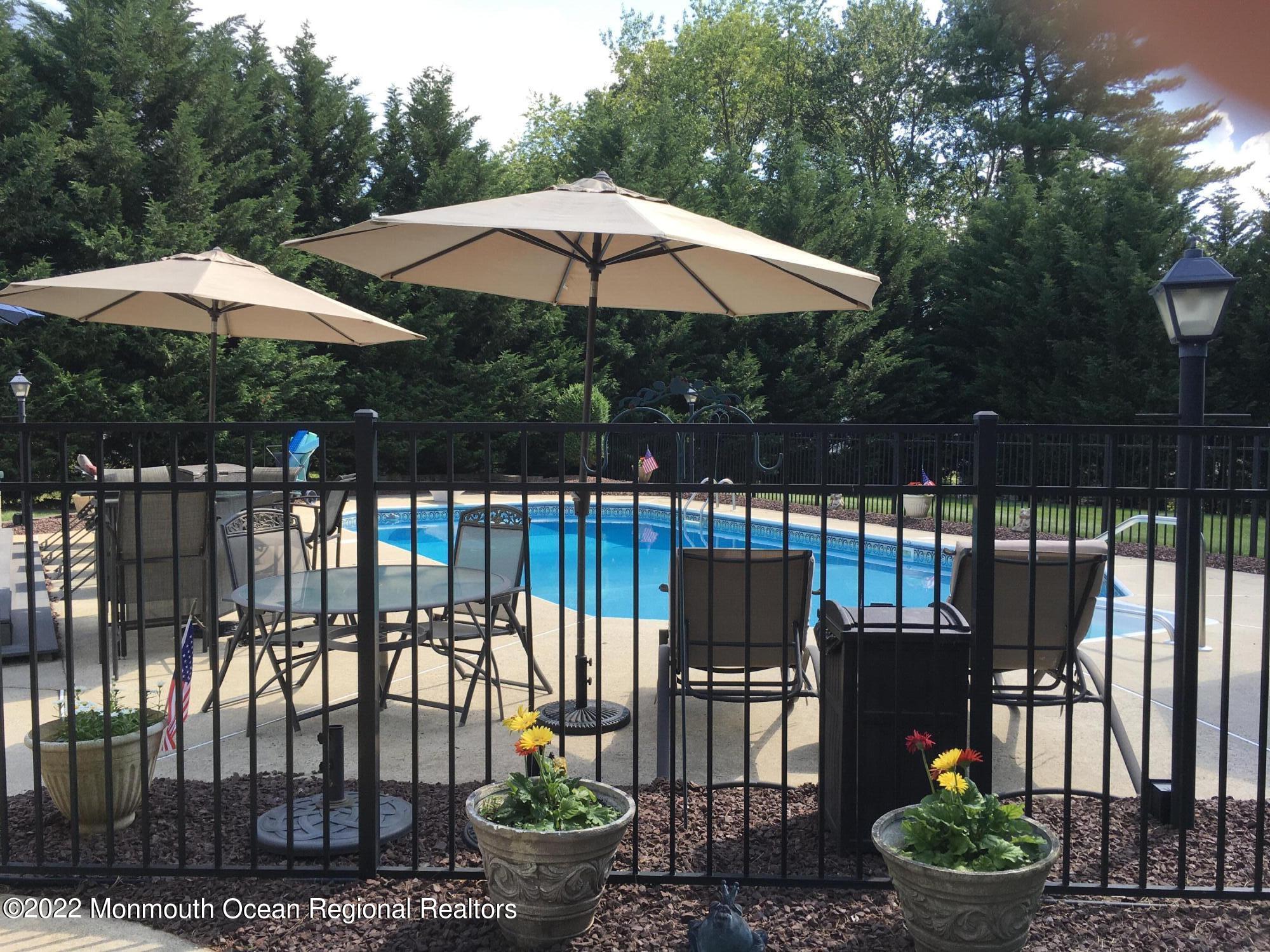 30 Homestead Road Freehold, NJ 07728 - Photo 10 of 42 a patio with water view fountain and a fire pit