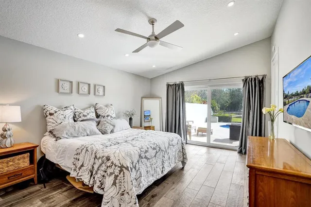 a bed room with a bed and a large window