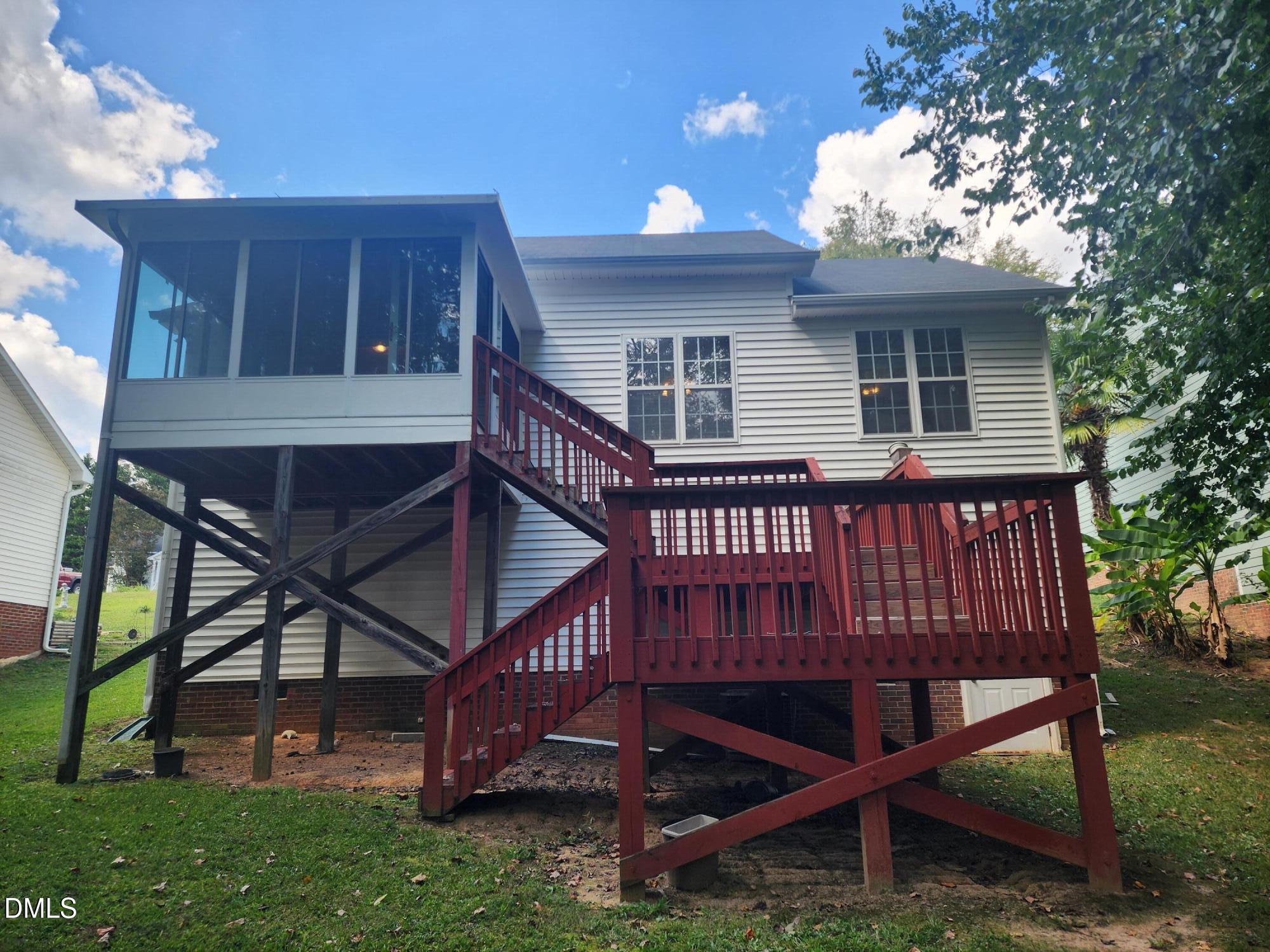 518 Johnson Street Garner, NC 27529 - Photo 17 of 17 a view of a house with backyard and porch