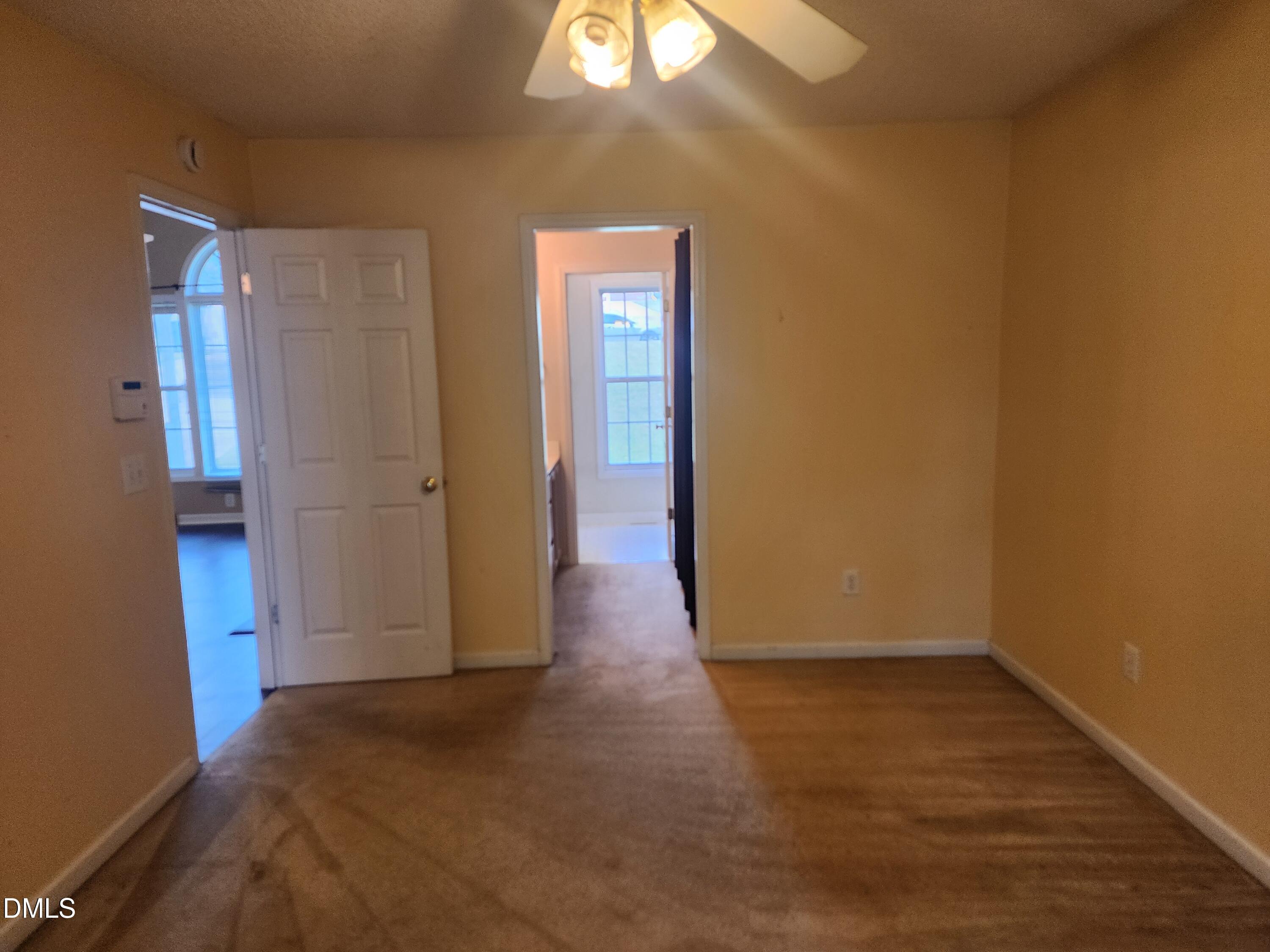 518 Johnson Street Garner, NC 27529 - Photo 9 of 17 a view of a room with wooden floor and a window