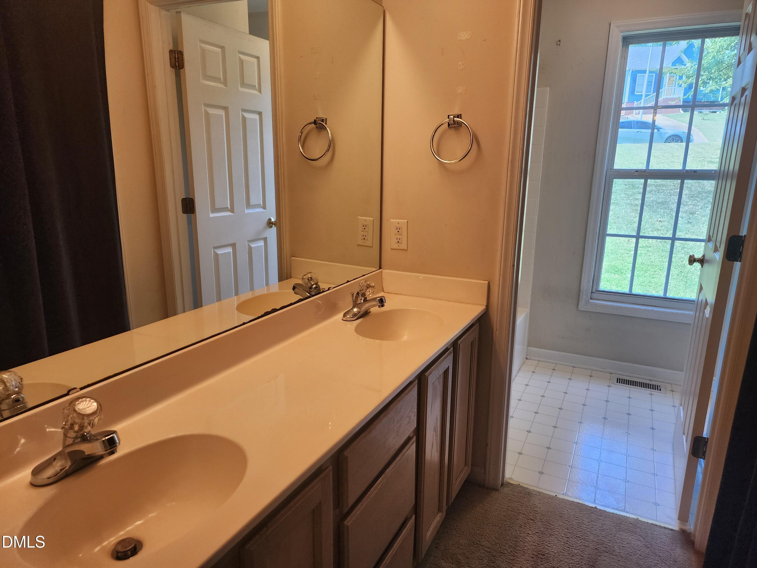 518 Johnson Street Garner, NC 27529 - Photo 10 of 17 a bathroom with a sink and a mirror