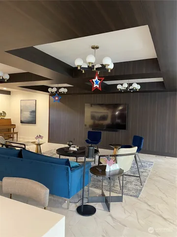 a living room with a bed and a table