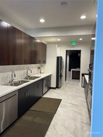 a bathroom with a glass shower door