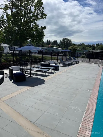 a living room with pool table