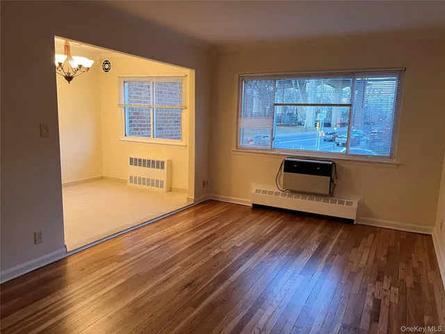a view of a hardwood floor in a room