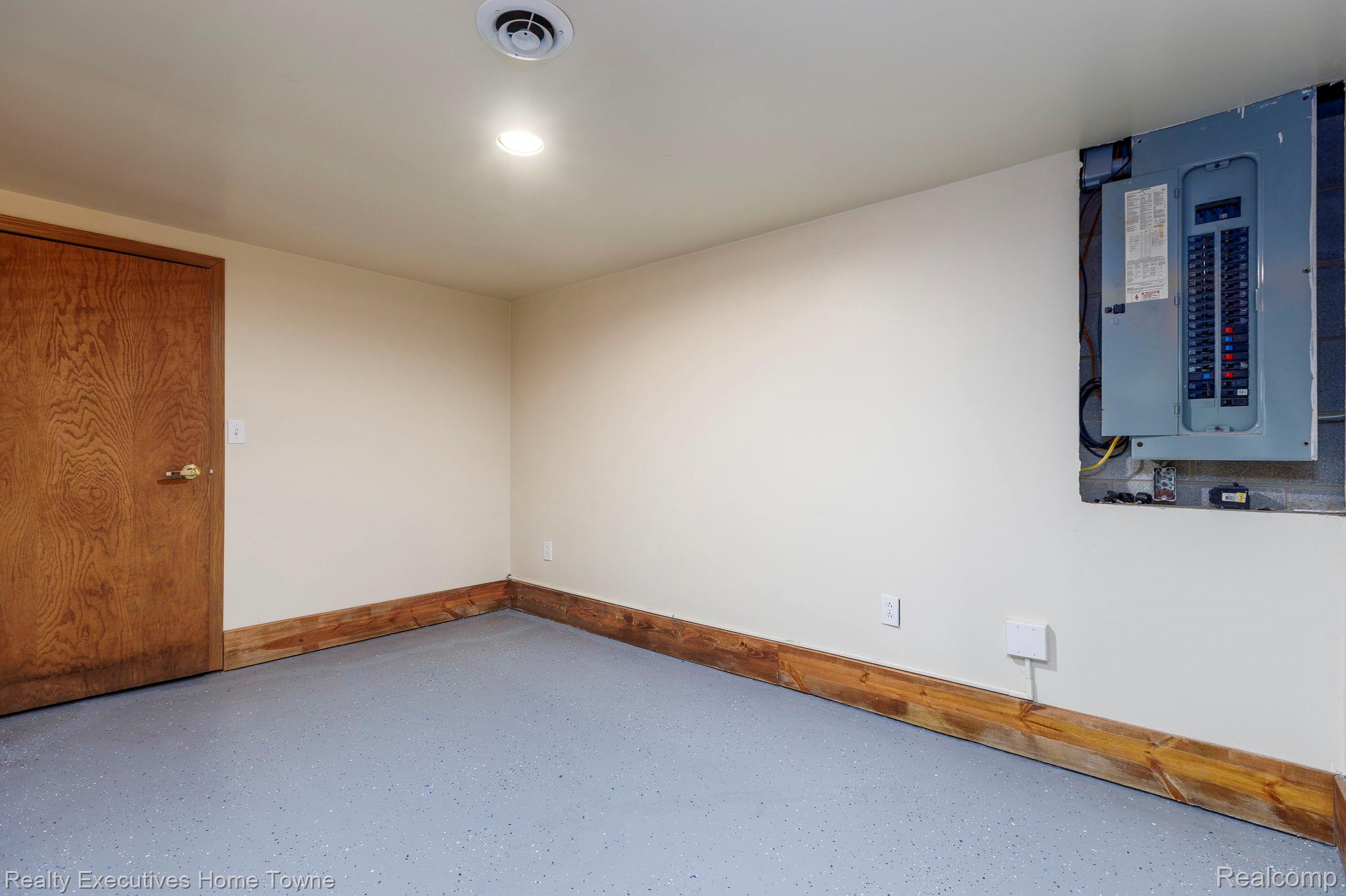 1041 Mackie Road Almont, MI 48003 - Photo 51 of 56 Unfurnished room featuring electric panel and speckled floor