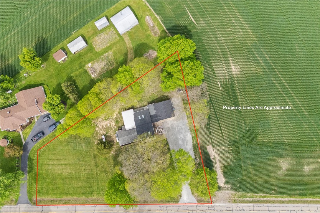 2950 Fairfield Pike Springfield, OH 45502 - Photo 40 of 48 This expansive aerial view showcases a property bordered by lush greenery and agricultural fields.