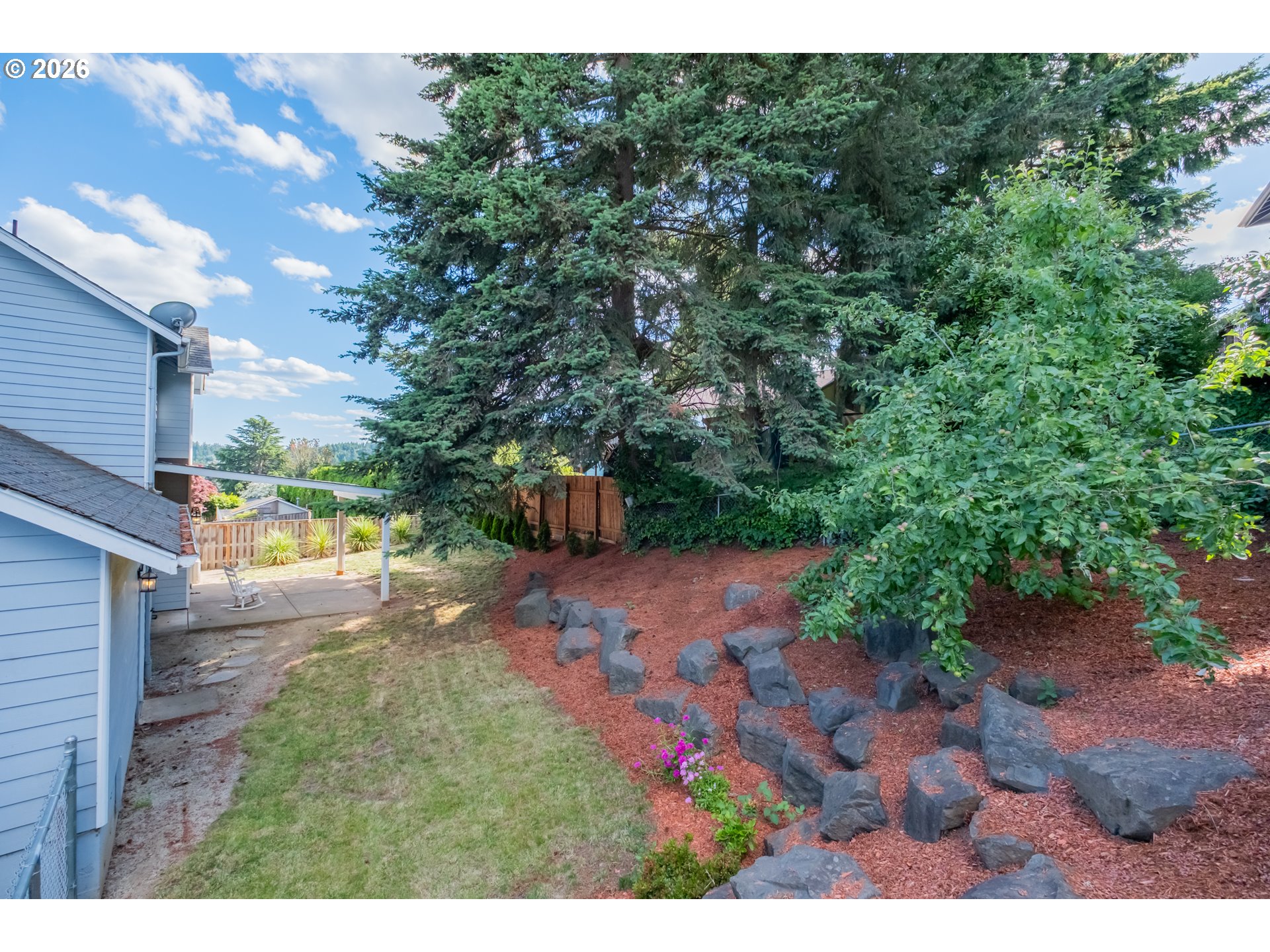 2925 Doaks Ferry Road Northwest Salem, OR 97304 - Photo 47 of 47 a view of a yard with plants and a bench