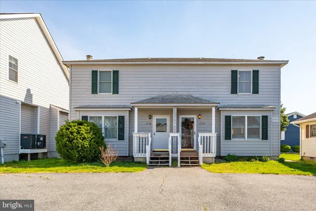 a view of swimming pool with outdoor seating and yard