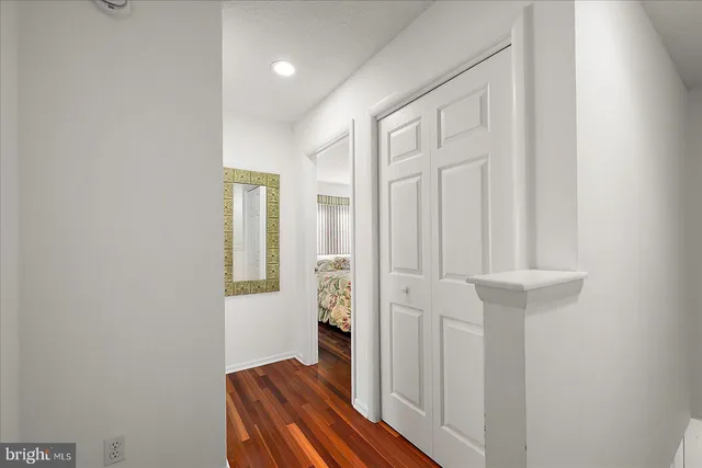 a bedroom with two beds and painted walls