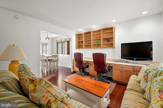 a view of a livingroom with furniture and a flat screen tv