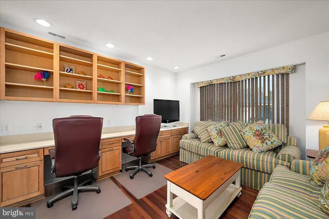 a workspace with furniture and a window