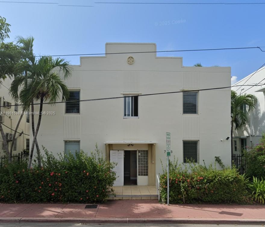 7928 Harding Avenue, Unit 2 Miami Beach, FL 33141 - Photo 13 of 19 a front view of a house with plants