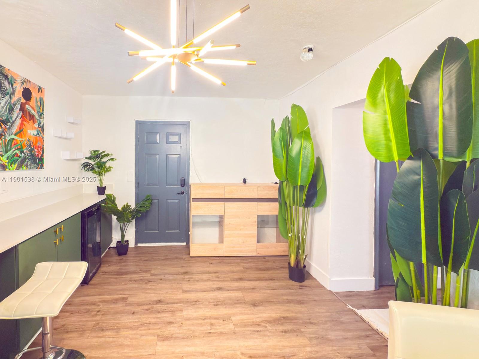 7928 Harding Avenue, Unit 2 Miami Beach, FL 33141 - Photo 4 of 19 a bedroom with a bed and a desk