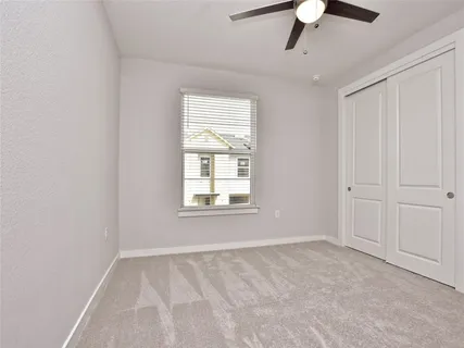 a bathroom with a sink vanity and a toilet