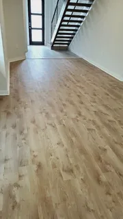 a view of an empty room with stairs